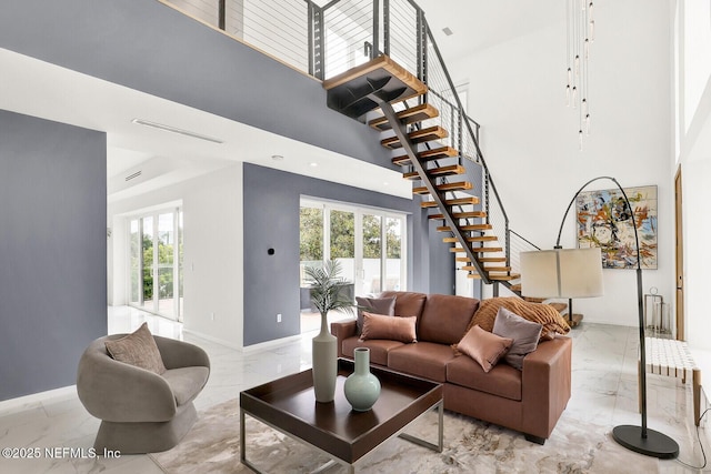 living room with a towering ceiling