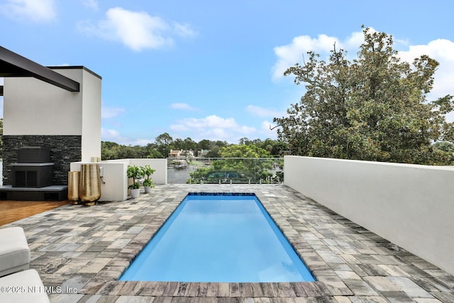 view of swimming pool featuring a patio