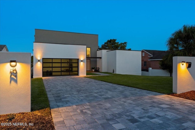 modern home featuring a lawn