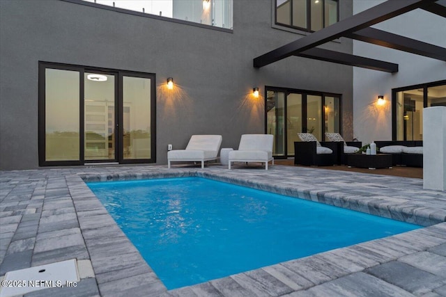 view of swimming pool featuring an outdoor hangout area and a patio