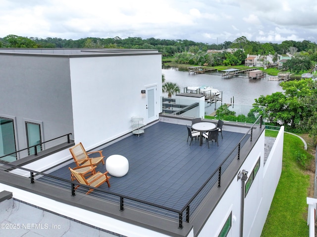 wooden deck featuring a water view