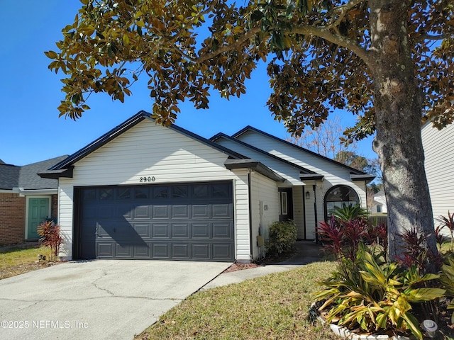 ranch-style house featuring a garage