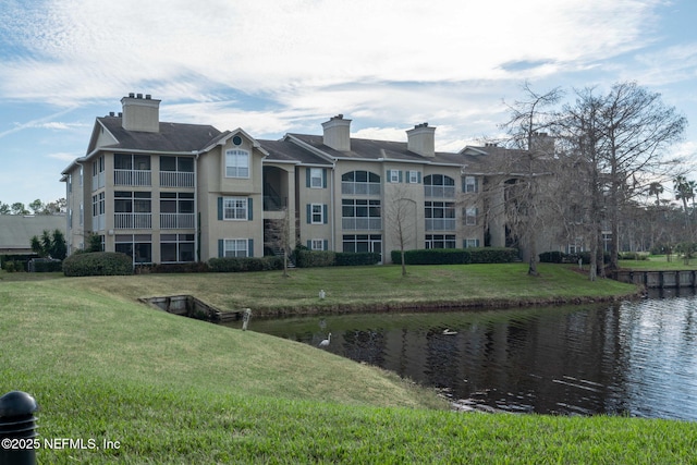 view of building exterior with a water view