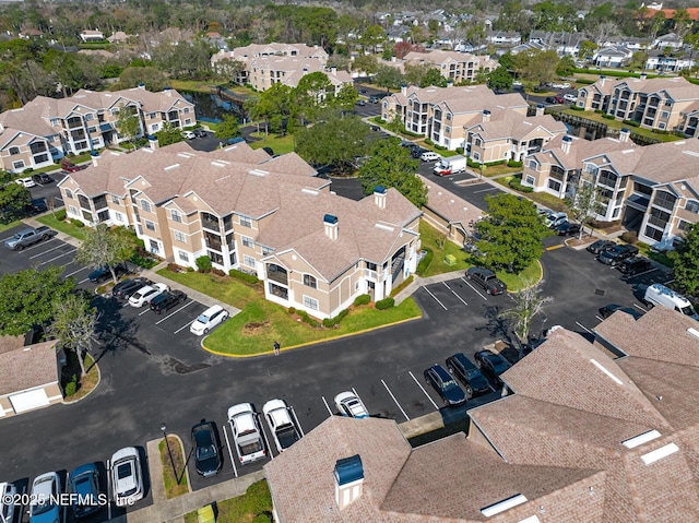 birds eye view of property with a residential view