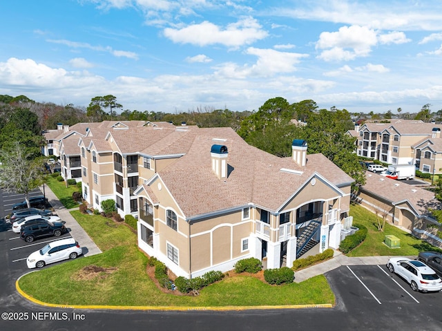 birds eye view of property with a residential view