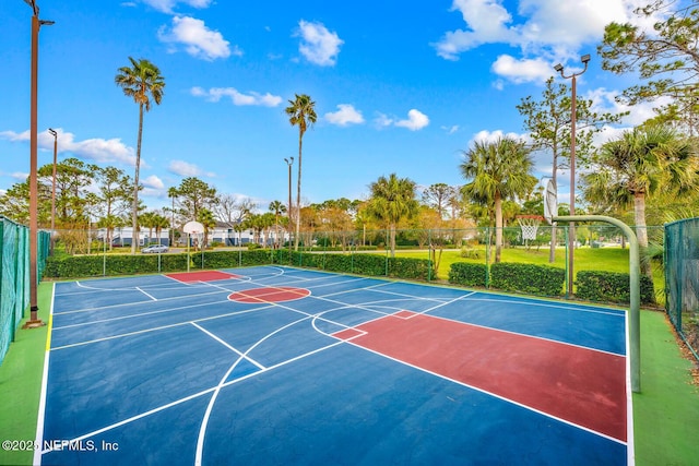 view of sport court featuring community basketball court and fence