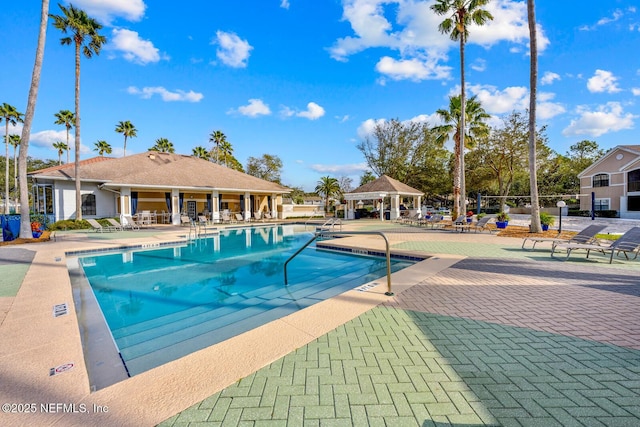 community pool featuring a gazebo and a patio area