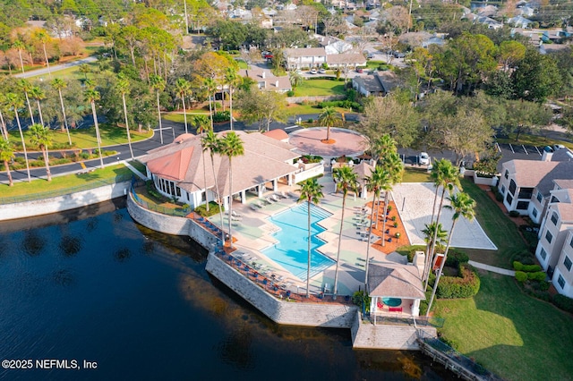 birds eye view of property featuring a water view and a residential view