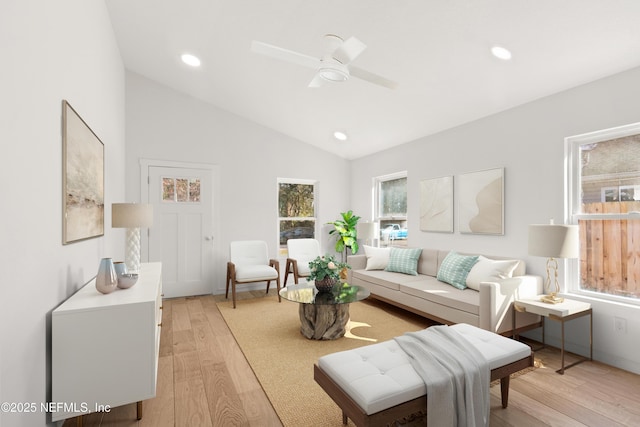 living area featuring vaulted ceiling, recessed lighting, a ceiling fan, and light wood-style floors