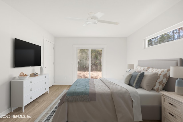 bedroom featuring access to exterior, light wood-style floors, baseboards, and a ceiling fan