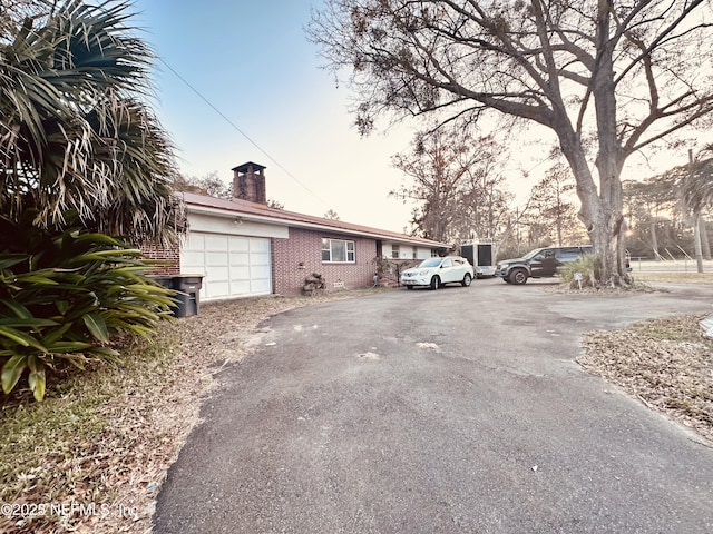 view of property exterior with a garage