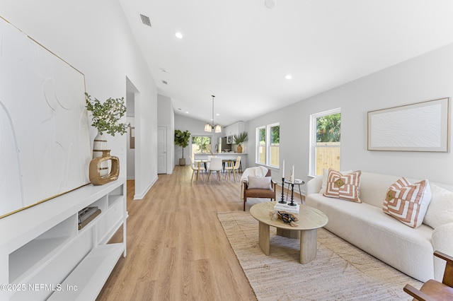 420 Herbert St, Saint Augustine, FL 32084 - living room with vaulted ceiling, visible vents, recessed lighting, and light wood-style floors