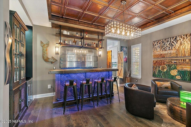 bar featuring dark wood-type flooring