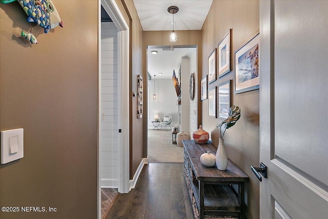 hall with dark hardwood / wood-style flooring