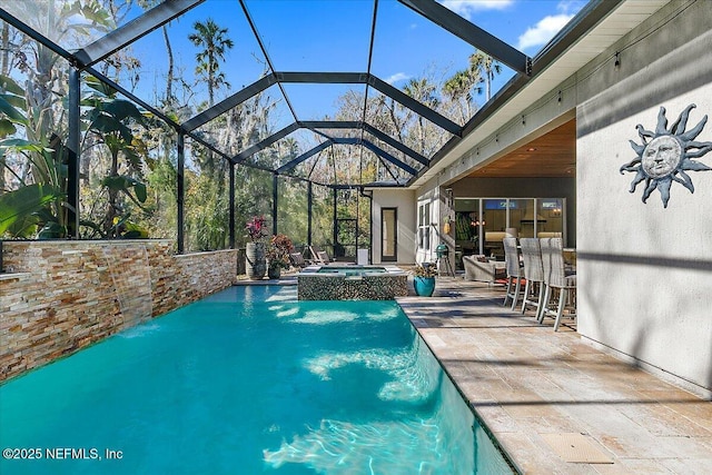 view of swimming pool featuring an in ground hot tub, a patio area, and glass enclosure