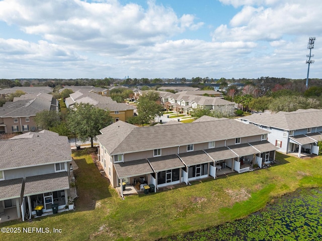 birds eye view of property with a residential view