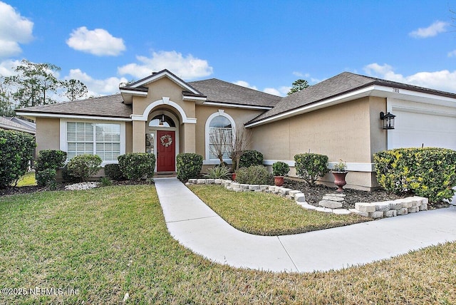 view of front of house featuring a garage and a front lawn