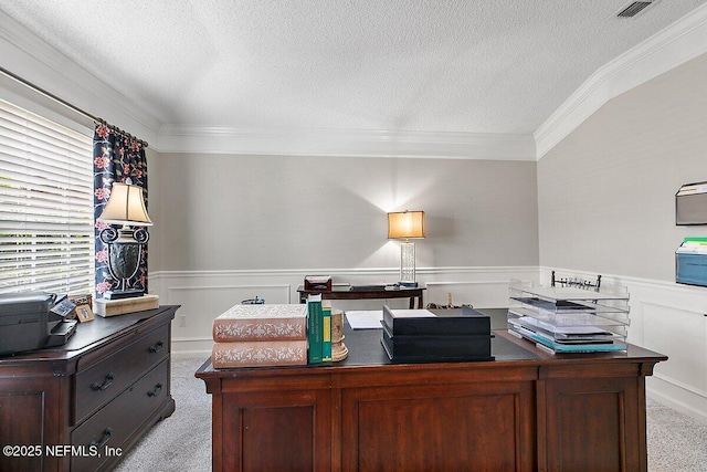 home office featuring ornamental molding, light colored carpet, and a textured ceiling