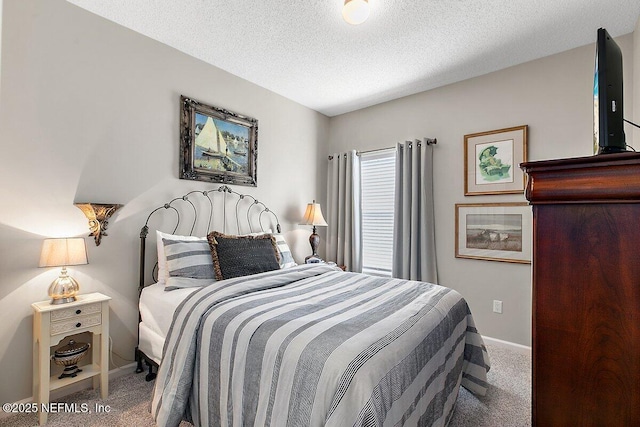 carpeted bedroom featuring a textured ceiling