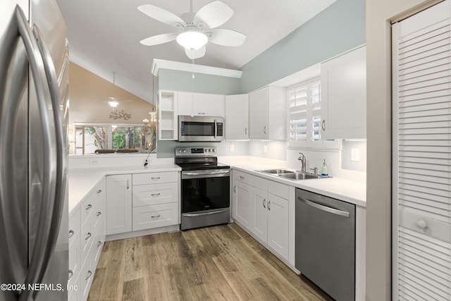 kitchen featuring sink, white cabinetry, appliances with stainless steel finishes, dark hardwood / wood-style floors, and ceiling fan