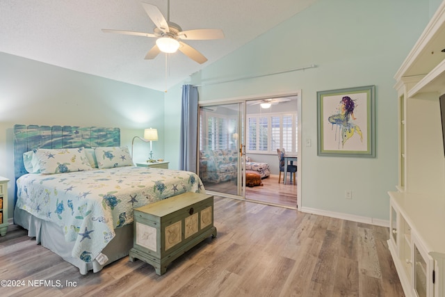 bedroom featuring hardwood / wood-style floors, high vaulted ceiling, and ceiling fan