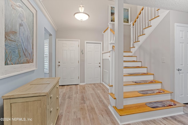 foyer with light hardwood / wood-style floors