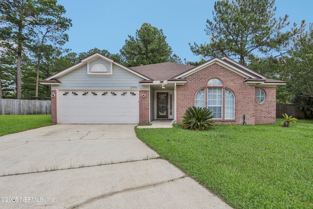 ranch-style house featuring a garage and a front lawn