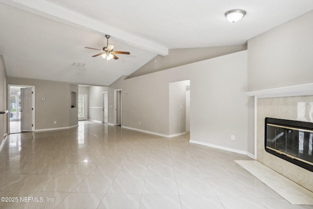 unfurnished living room with ceiling fan, a high end fireplace, and lofted ceiling with beams