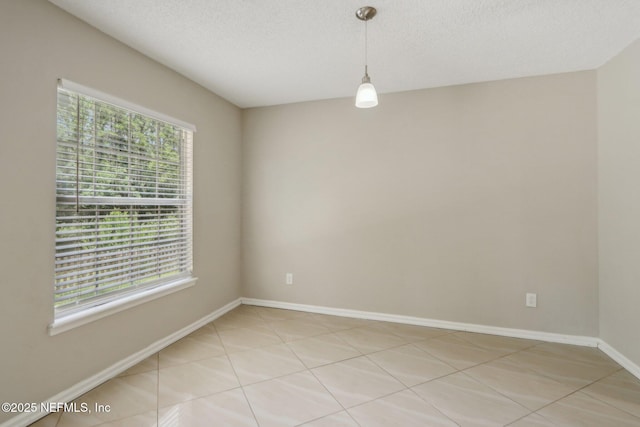 empty room featuring a textured ceiling