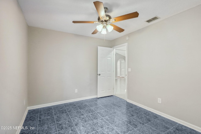 unfurnished room with ceiling fan