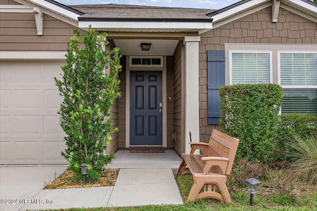 doorway to property featuring a garage