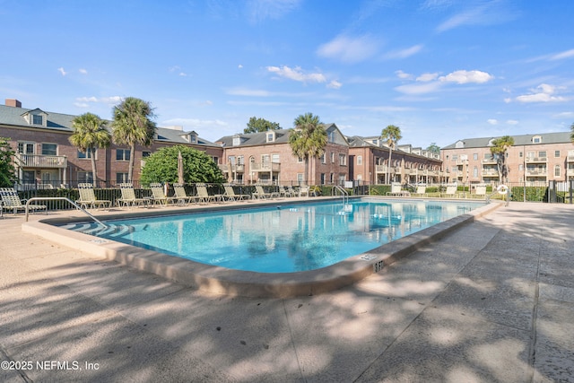 view of swimming pool with a patio area