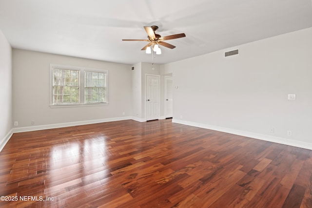 unfurnished room featuring ceiling fan and dark hardwood / wood-style flooring