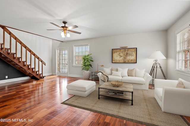 living room with hardwood / wood-style flooring and ceiling fan