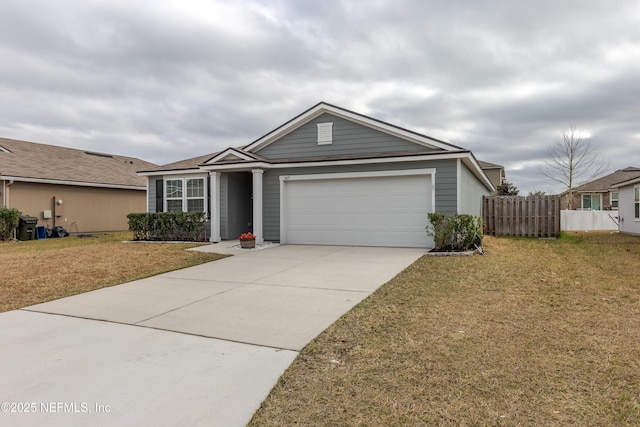 single story home featuring a garage and a front lawn