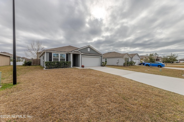 ranch-style home featuring a garage, concrete driveway, a front lawn, and a residential view