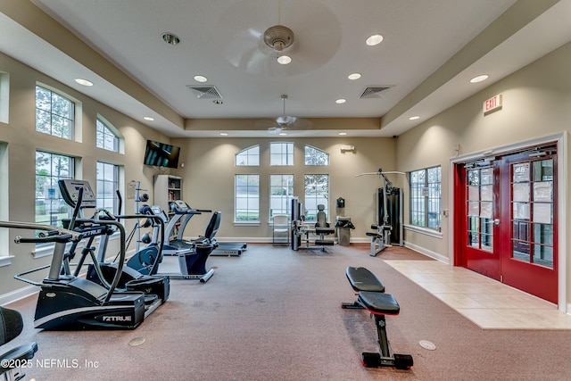 workout area with french doors, visible vents, and a healthy amount of sunlight