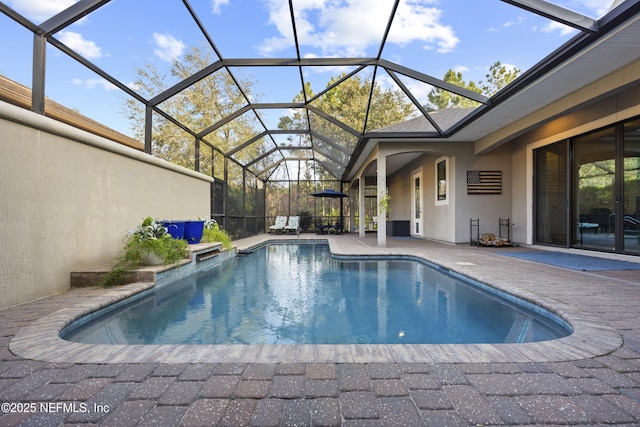 view of pool with a lanai, cooling unit, and a patio area