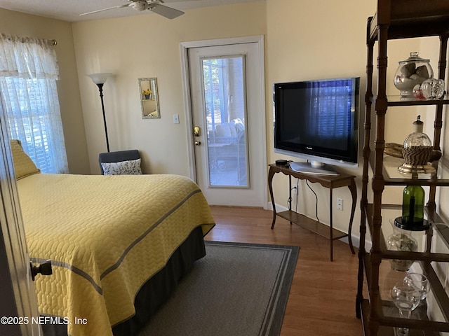 bedroom with dark hardwood / wood-style flooring