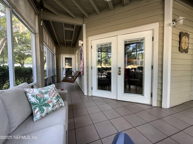 sunroom / solarium with french doors and beamed ceiling