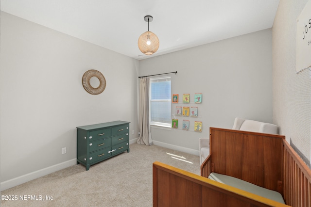 bedroom with carpet and baseboards