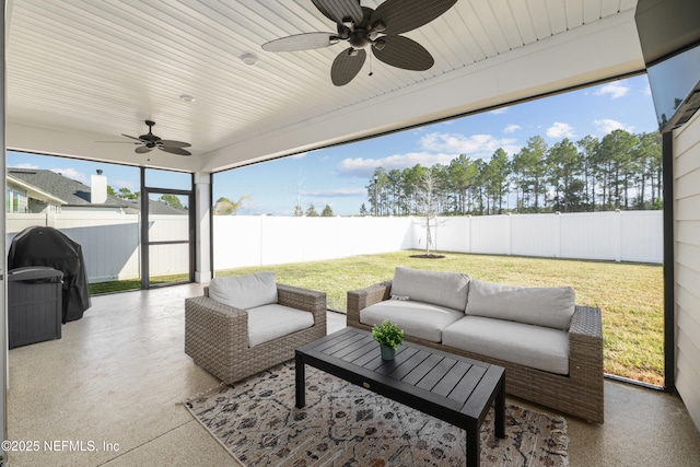 view of patio / terrace featuring an outdoor hangout area, area for grilling, a fenced backyard, and a ceiling fan