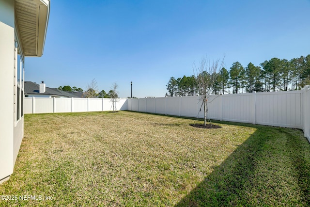 view of yard featuring a fenced backyard