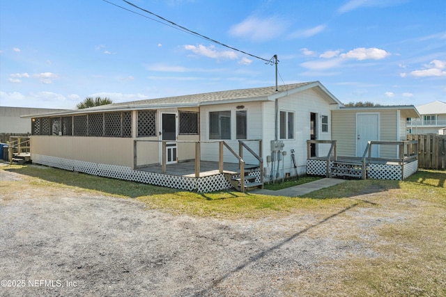 view of front of property with a wooden deck