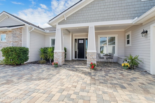 property entrance with covered porch