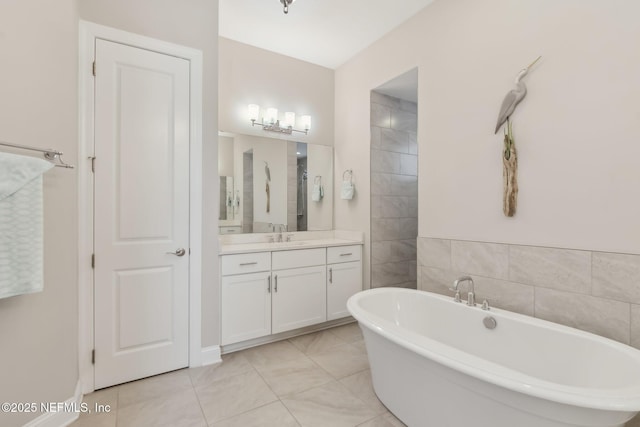 bathroom featuring vanity and a tub