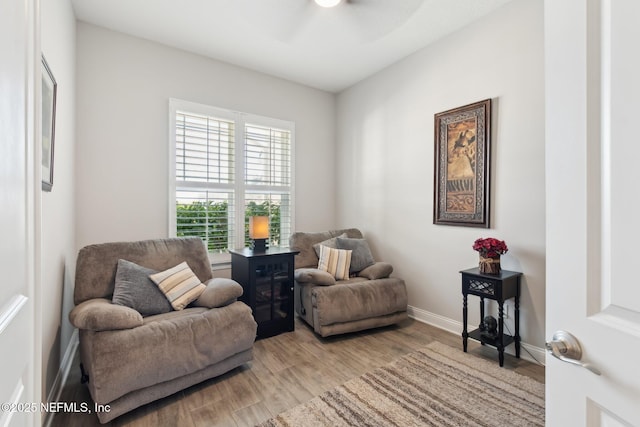 sitting room with hardwood / wood-style floors