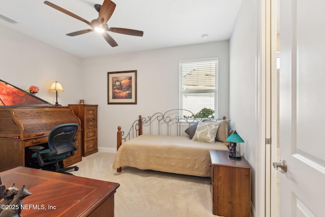 bedroom with light carpet and ceiling fan