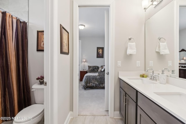 bathroom with vanity and toilet