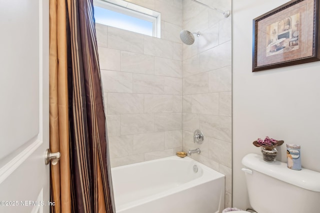 bathroom with shower / bathtub combination with curtain and toilet